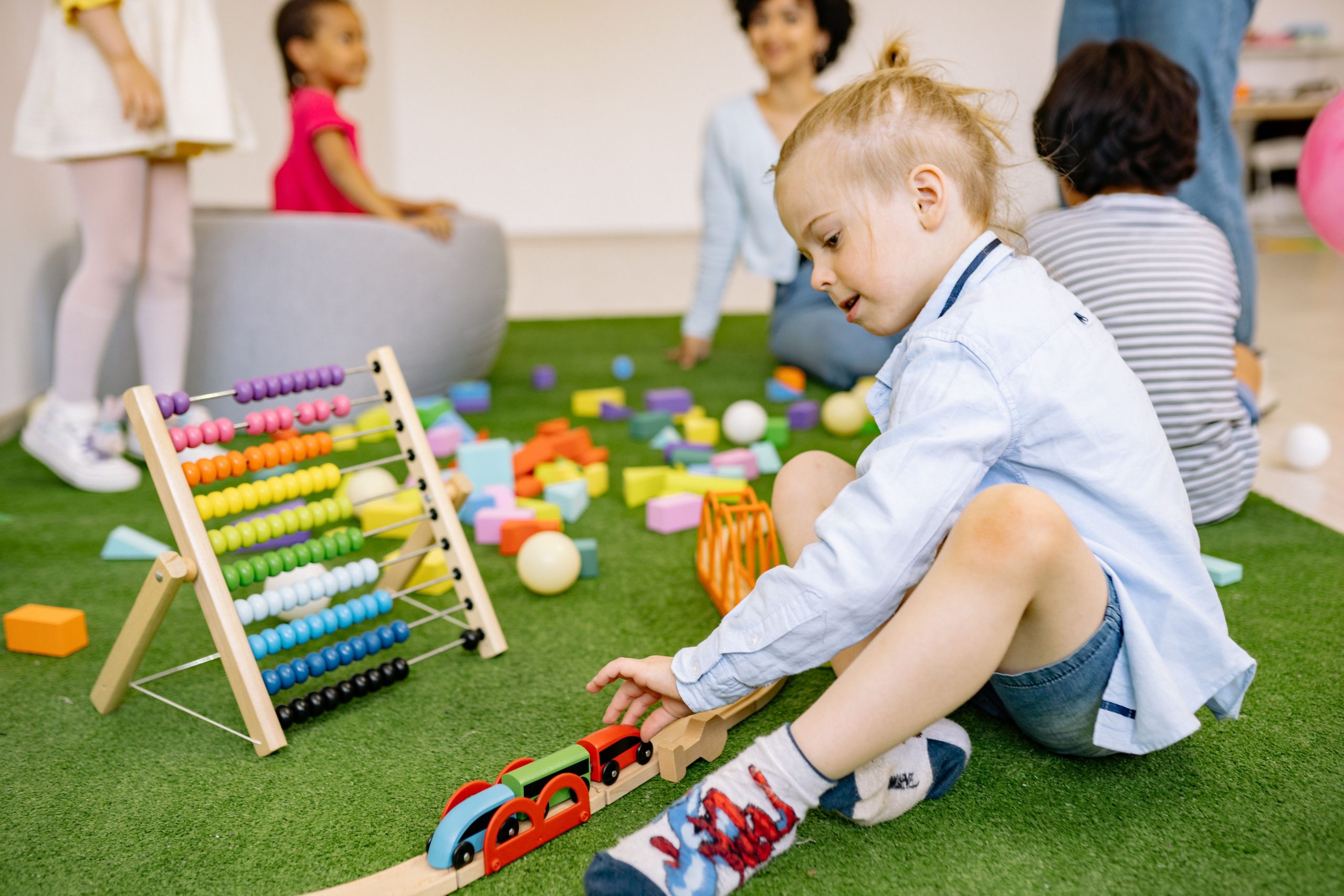 Kids enjoying playtime with toys and activities in a vibrant kindergarten setting.